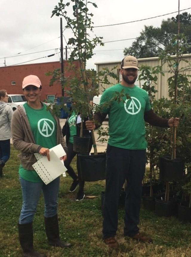 IP volunteers distribute free trees after a hurricane along with Arbor Day Foundation